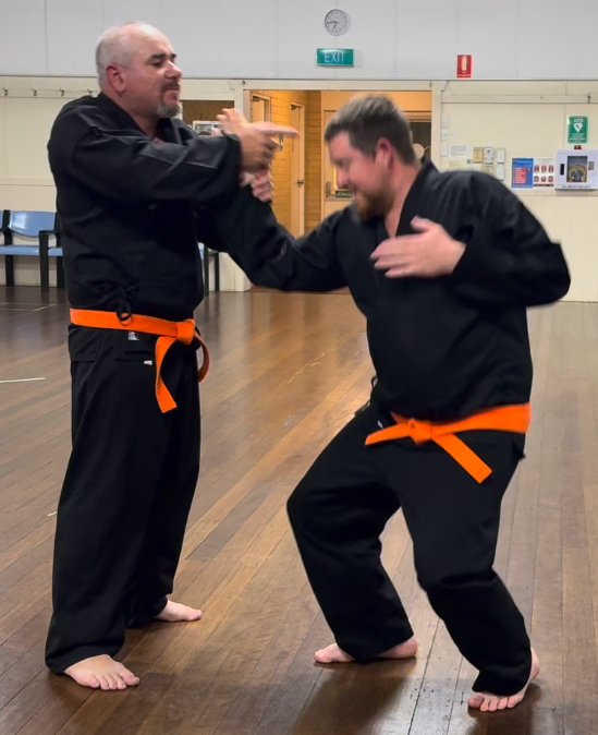 Jung Shin Hapkido students practising joint lock technique at Alstonville dojo